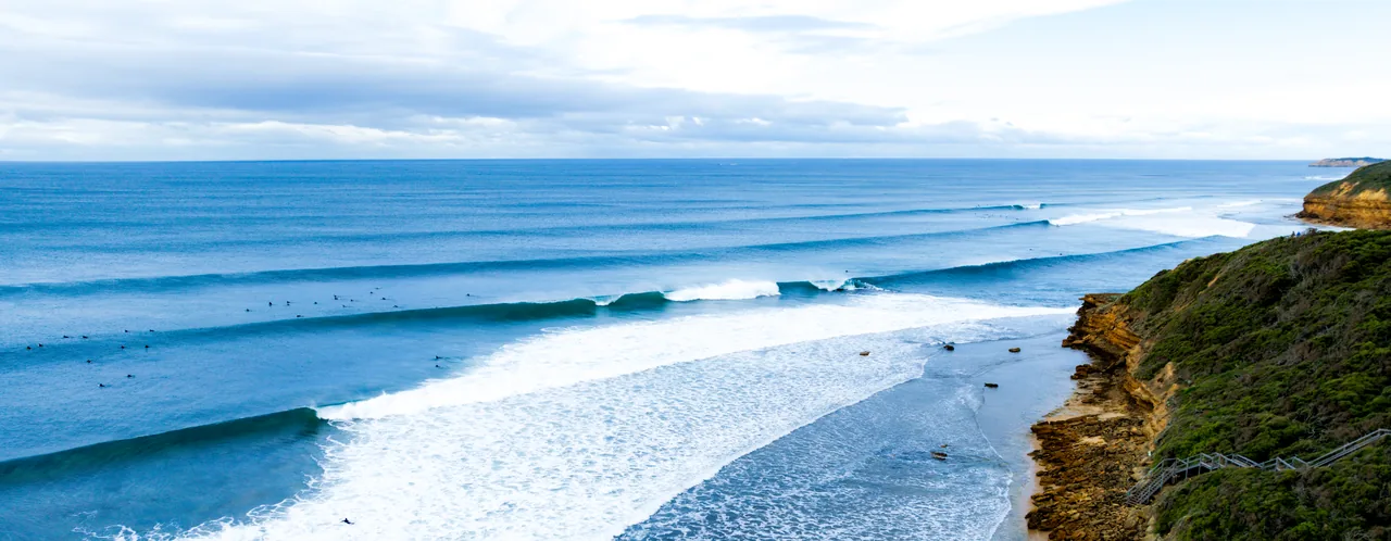 Aerial view of waves breaking along the Surf Coast