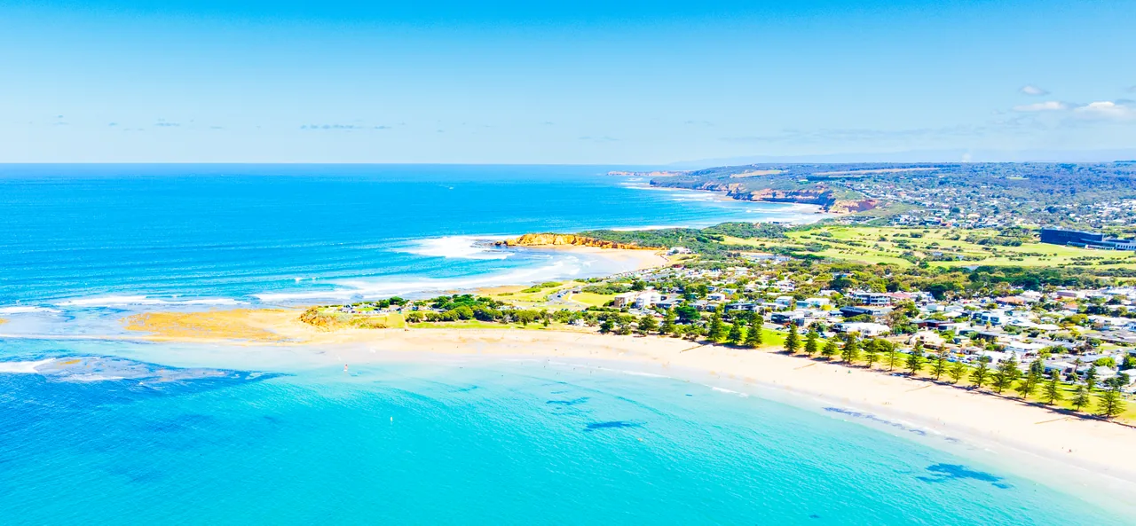 Aerial view of coastal homes beside the beach on the Surf Coast
